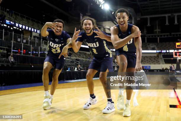 Sheldon Stevens, Kareem Thompson and Jamie Bergens of the Oral Roberts Golden Eagles celebrate after defeating the Florida Gators in the second round...