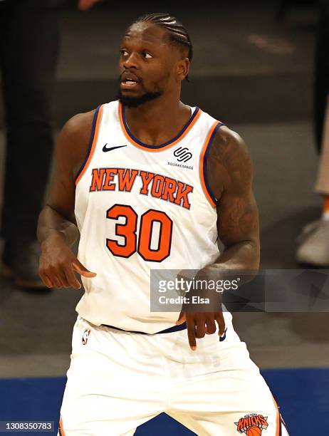 Julius Randle of the New York Knicks celebrates his three point shot to tie the game and force overtime against the Philadelphia 76ers at Madison...