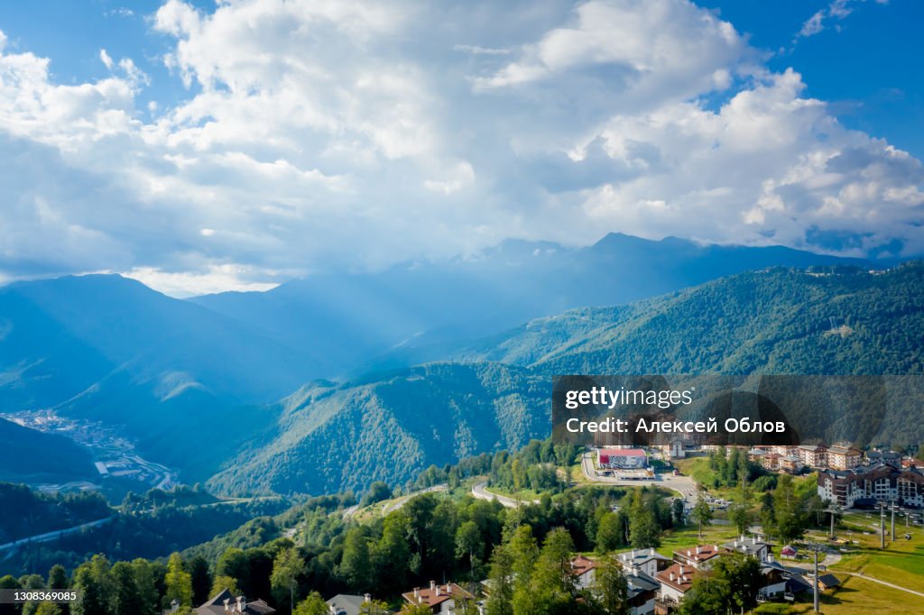 Summer aerial view of the Ski Resort Rosa Khutor. A complex of hotels on the site of the former Olympic village of Rosa Plateau at an altitude of 1170 m from sea level. Krasnaya Polyana, Sochi, Russia