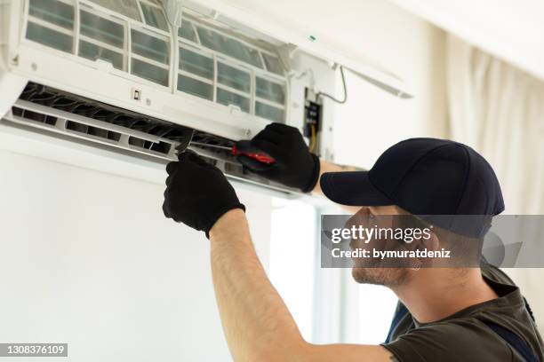 air conditioner repairers - hvac service stock pictures, royalty-free photos & images