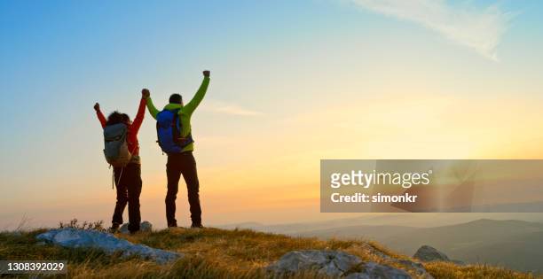 rear view of mature couple standing on mountain - slovenia hiking stock pictures, royalty-free photos & images
