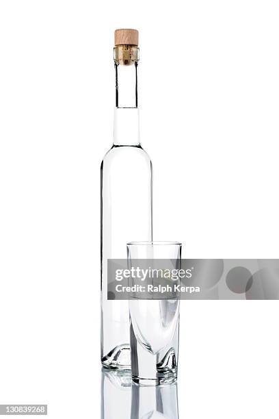 bottle of grappa with a glass - grappa stock pictures, royalty-free photos & images