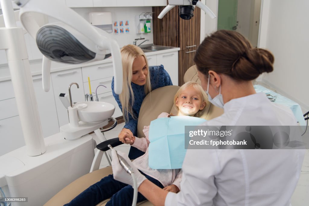 Mom and her little daughter visiting a pediatric dental specialist