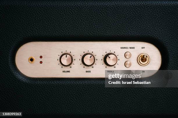 from above view of the front controls of an electric guitar amplifier - stereo fotografías e imágenes de stock