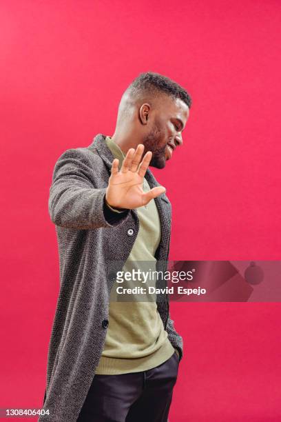stylish black man showing no gesture - shy fotografías e imágenes de stock