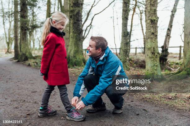 help from daddy - shoelace stock pictures, royalty-free photos & images