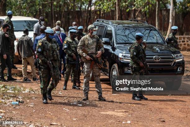 United Nations peacekeepers and private security personnel protect the convoy of the president of the Central African Republic, Faustin-Archange...