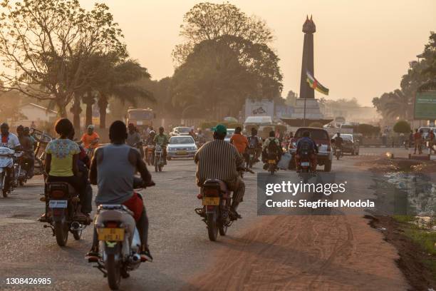 Motorists pass on a busy main road on March 19, 2021 in the capital Bangui, Central African Republic. Violence broke out in the Central African...