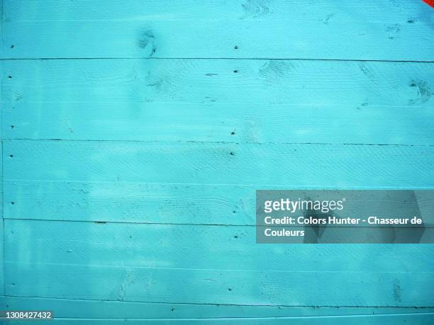 clean and turquoise painted wooden planks with natural light in paris - wooden surface stock-fotos und bilder