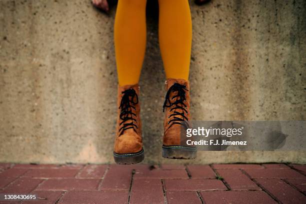 close-up of woman legs with shoes and brown stockings - tights stock pictures, royalty-free photos & images