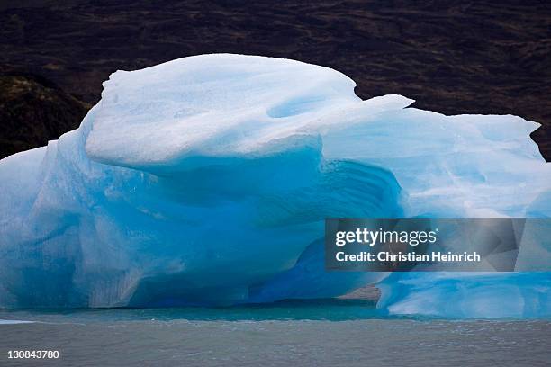 Iceberg with a cave in the lake Lago Argentino, national park Los Glaciares, (Parque Nacional Los Glaciares), Patagonia, Argentina, South America