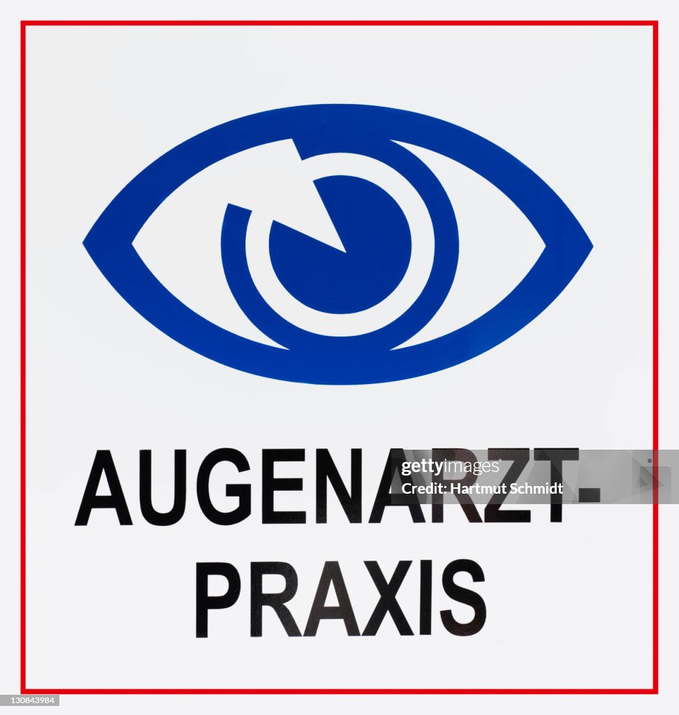 Sign: Augenarztpraxis, German for: eye specialist's surgery, with eye symbol
