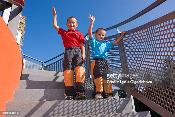 boys, 6 and 4 years, on a staircase - length stock pictures, royalty-free photos & images