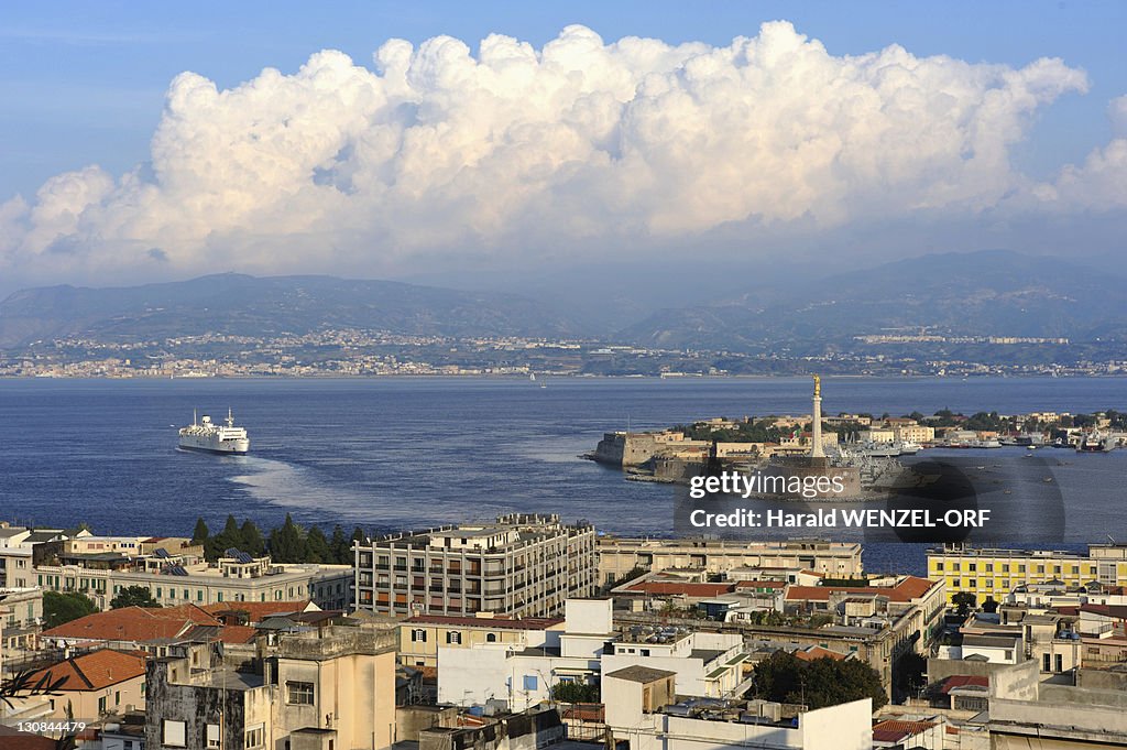 Messina and narrows, panorama view, inner harbour and ferryboat en-route, mainland at back, Sicily, Italy, Europe