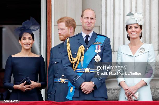 Meghan, Duchess of Sussex, Prince Harry, Duke of Sussex, Prince William, Duke of Cambridge and Catherine, Duchess of Cambridge watch a flypast to...