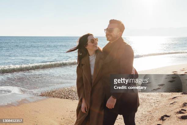 happiness by the beach - arab couple stock pictures, royalty-free photos & images