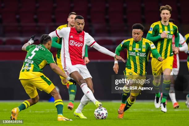 Juan Familia Castillo of ADO Den haag, Ryan Gravenberch of Ajax and Vicente Besuijen of ADO Den Haag during the Eredivisie match between Ajax and ADO...