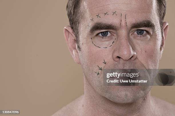portrait of a man with lines on his face for a cosmetic surgery - plastic surgery stockfoto's en -beelden