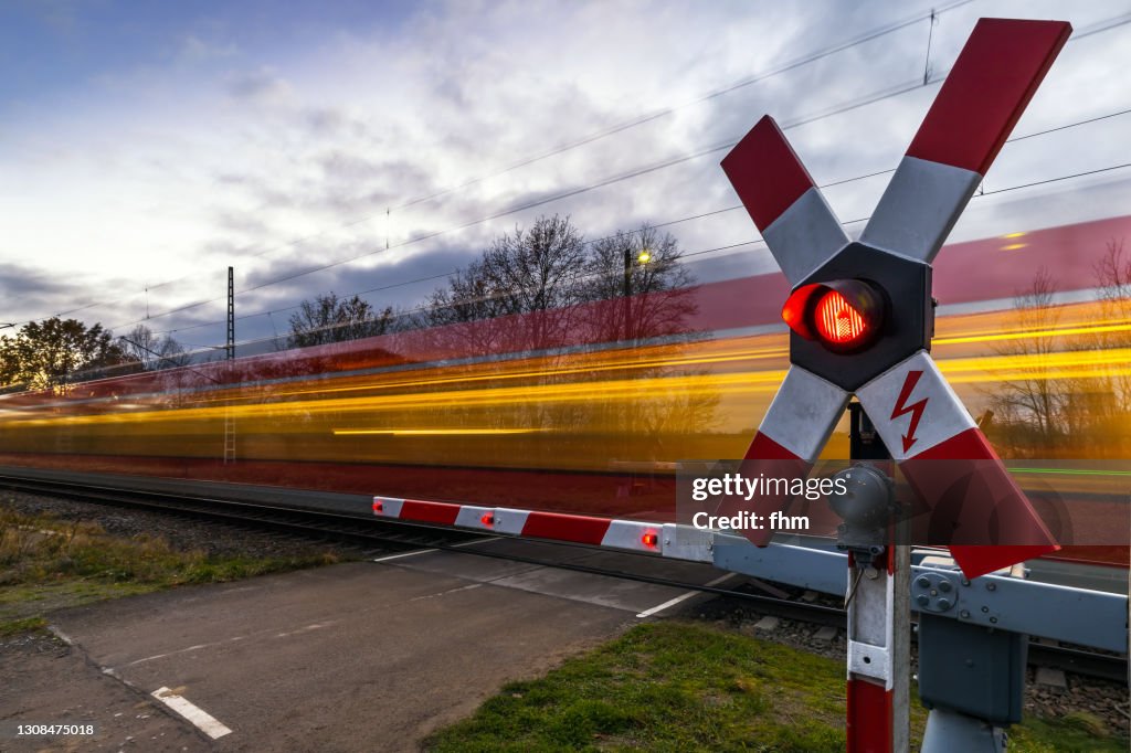 Rail crossing with fast train