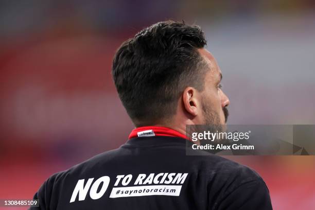 Goalkeeper Raphael Wolf of Duesseldorf warms up with an anti-racism message on his short prior to the Second Bundesliga match between Fortuna...