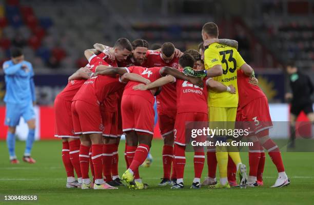 Team captain Adam Bodzek and team mates of Duesseldorf huddle prior to the Second Bundesliga match between Fortuna Düsseldorf and VfL Bochum 1848 at...