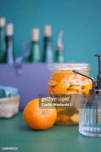 diy cleaning supplies made from vinegar and orange peel - vinegar stockfoto's en -beelden