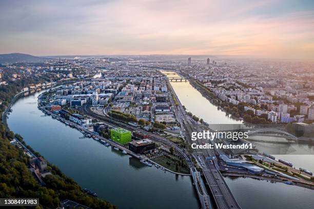 france, auvergne-rhone-alpes, lyon, aerial view of city situated at confluence of rhone and saone rivers at dusk - rhone stock-fotos und bilder