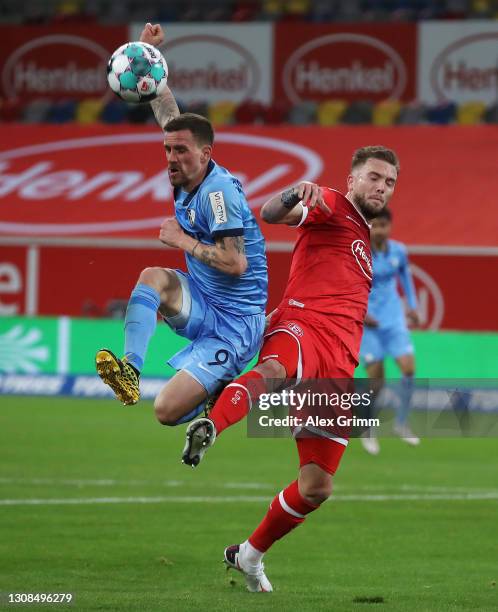 Simon Zoller of Bochum is challenged by Andre Hoffmann of Duesseldorf during the Second Bundesliga match between Fortuna Düsseldorf and VfL Bochum...