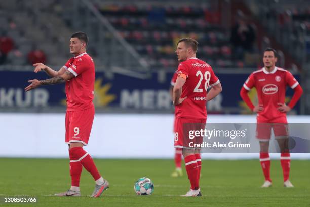 Dawid Kownacki and Rouwen Hennings of Duesseldorf react after Soma Novothny of Bochum scored his team's third goal during the Second Bundesliga match...