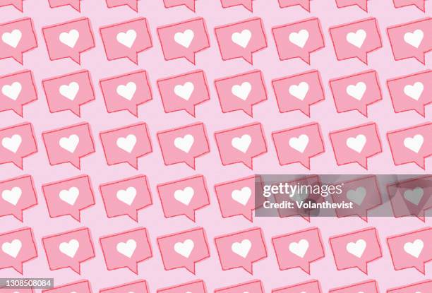 social media love red heart icon on pink background - dating app photos et images de collection