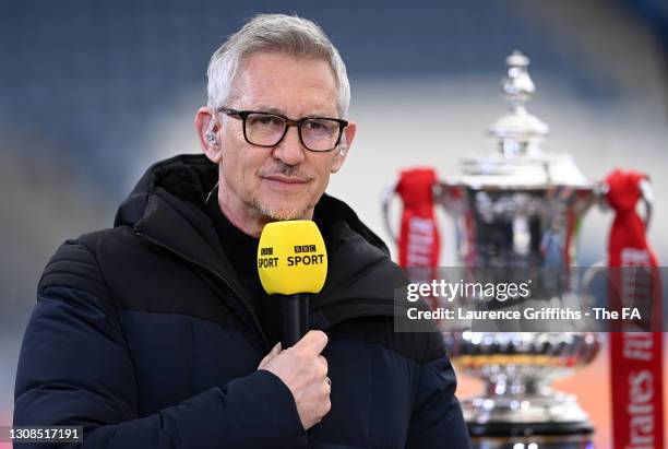 Pundit, Gary Lineker presents Match of the Day with the FA Cup Trophy on display during the Emirates FA Cup Quarter Final match between Leicester...