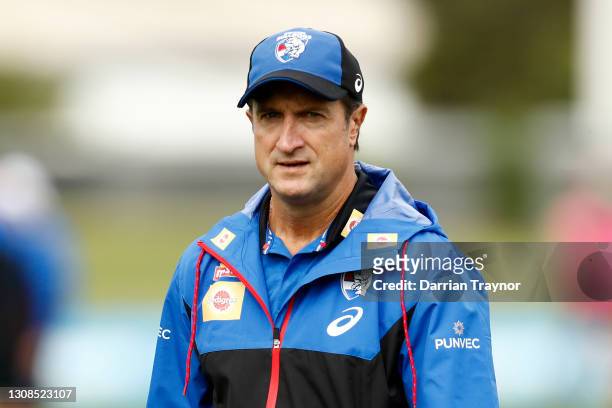 Luke Beveridge , Senior Coach of the Bulldogs looks on during a Western Bulldogs AFL training session at Whitten Oval on March 23, 2021 in Melbourne,...