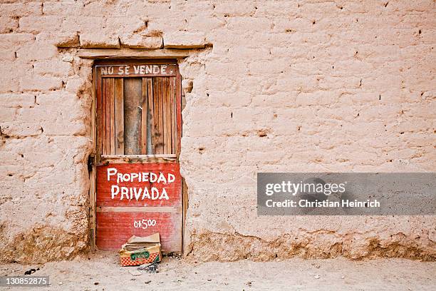 decayed door in a house facade, city center of uyuni, altiplano, bolivia, south america - southernly stock pictures, royalty-free photos & images