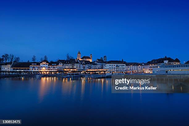 rapperswil - the promenade and the rapperswil castle at dawn - canton of st. gallen, switzerland, europe. - st gallen canton stock pictures, royalty-free photos & images