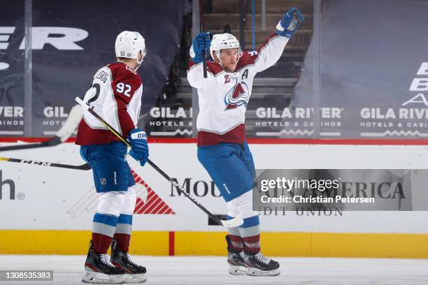 Mikko Rantanen of the Colorado Avalanche celebrates with Gabriel Landeskog after scoring a goal against the Arizona Coyotes during the first period...