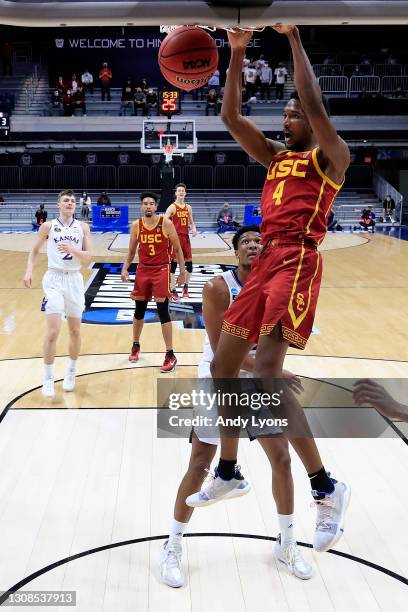 Evan Mobley of the USC Trojans dunks the ball against the Kansas Jayhawks in the first half of their second round game of the 2021 NCAA Men's...