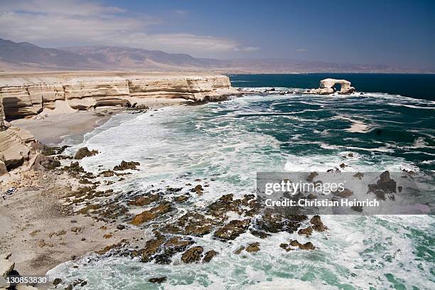 the coast and the natural arch la portada, landmark from the town and the region antofagasta, chile, south america - southernly stock pictures, royalty-free photos & images
