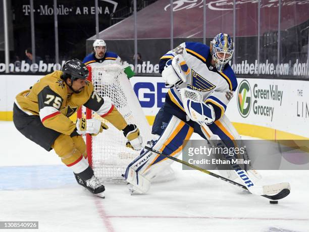 Ryan Reaves of the Vegas Golden Knights steals the puck as Jordan Binnington of the St. Louis Blues tries to clear it in the second period of their...