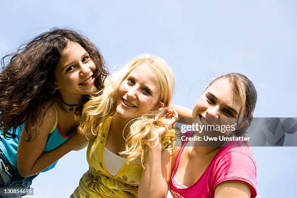 portrait of three smiling girls - complexion stock-fotos und bilder