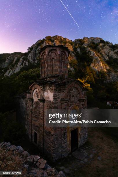 view of star trail over matka monastery at night, canyon matka, skopje, north macedonia - starry vault stock pictures, royalty-free photos & images