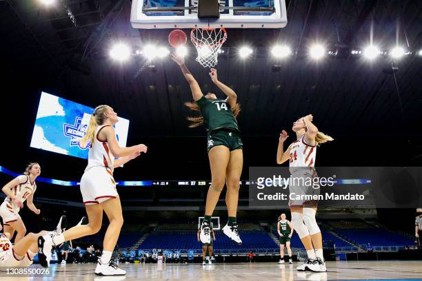 Taiyier Parks of the Michigan State Spartans puts up a basket against defender Ashley Joens of the Iowa State Cyclones in the first round game of the...