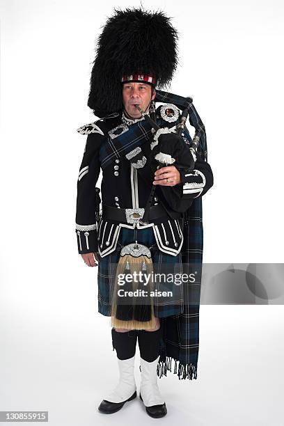a scottish piper - piper stock pictures, royalty-free photos & images