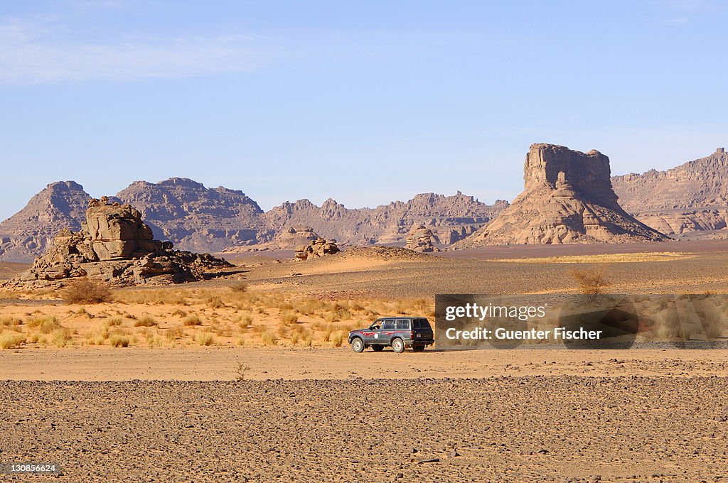 Jeep in the hamada desert, Acacus Mountains, Sahara, Libya