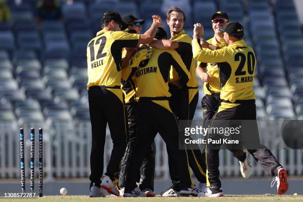 Sam Whiteman of Western Australia is congratulated by team mates after running out Will Sutherland of Victoria during the Marsh One Day Cup match...
