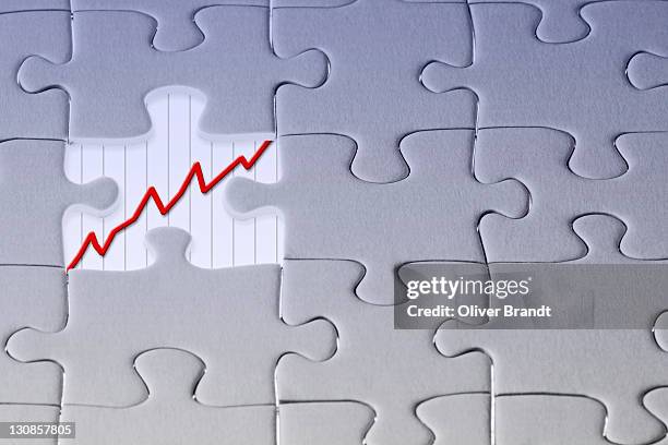 jigsaw puzzle, the last missing piece revealing a diagramm - diagramm stock pictures, royalty-free photos & images