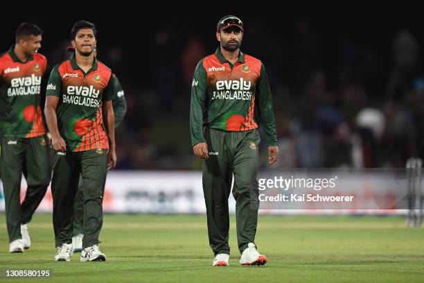 Captain Tamim Iqbal Khan of Bangladesh and his team mates walk from the ground after their loss in game two of the One Day International series...