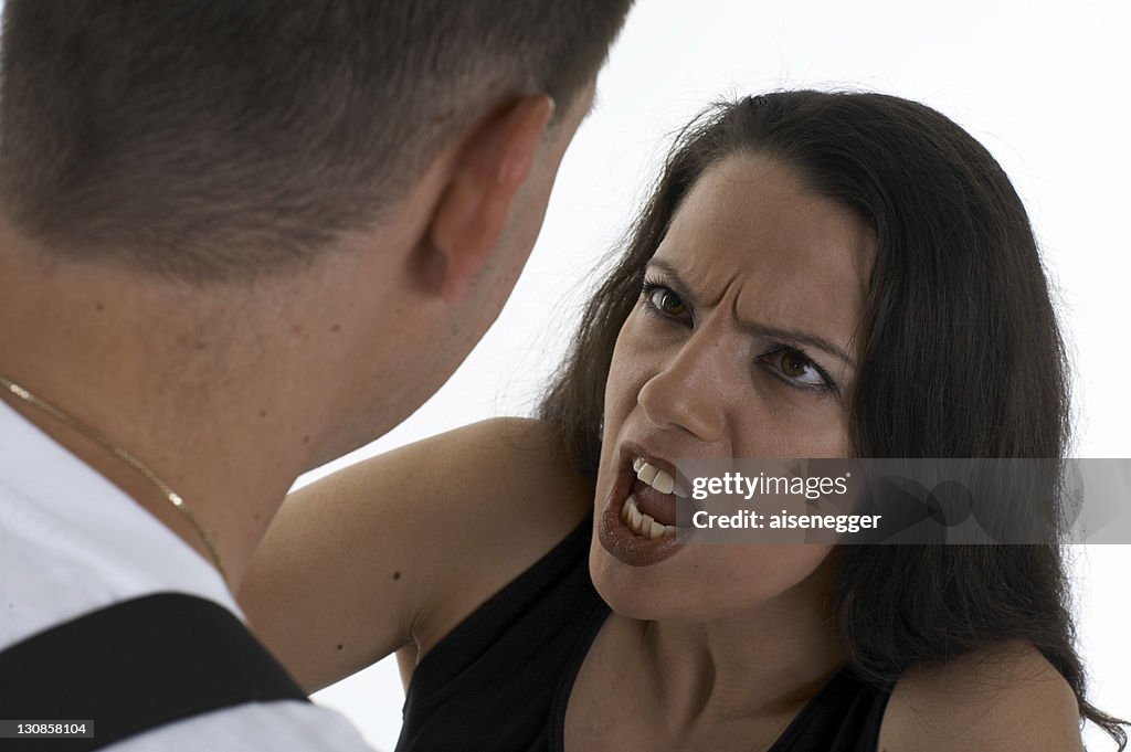 Woman shouting at a man, telling him off