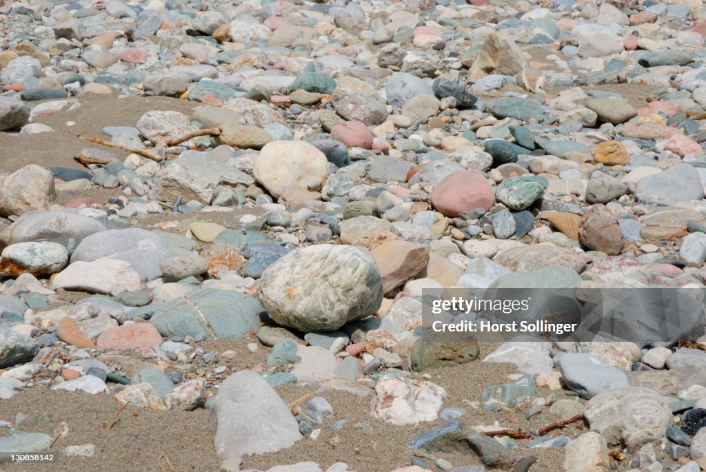 Riverside bank with multi coloured gravel of central alpine origine, Bavaria, Germany