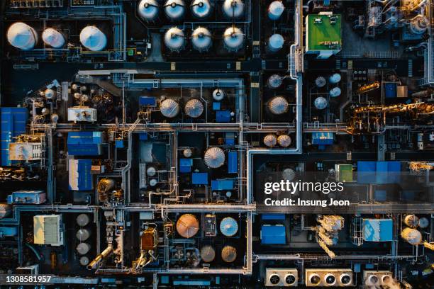 aerial view of oil refinery in petrochemical complex - petrochemie stock-fotos und bilder