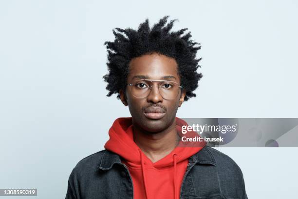 confident man in red hoodie - blank expression stock pictures, royalty-free photos & images